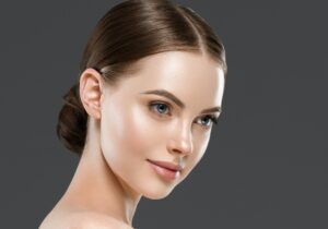 Beautiful face woman healthy skin gray background